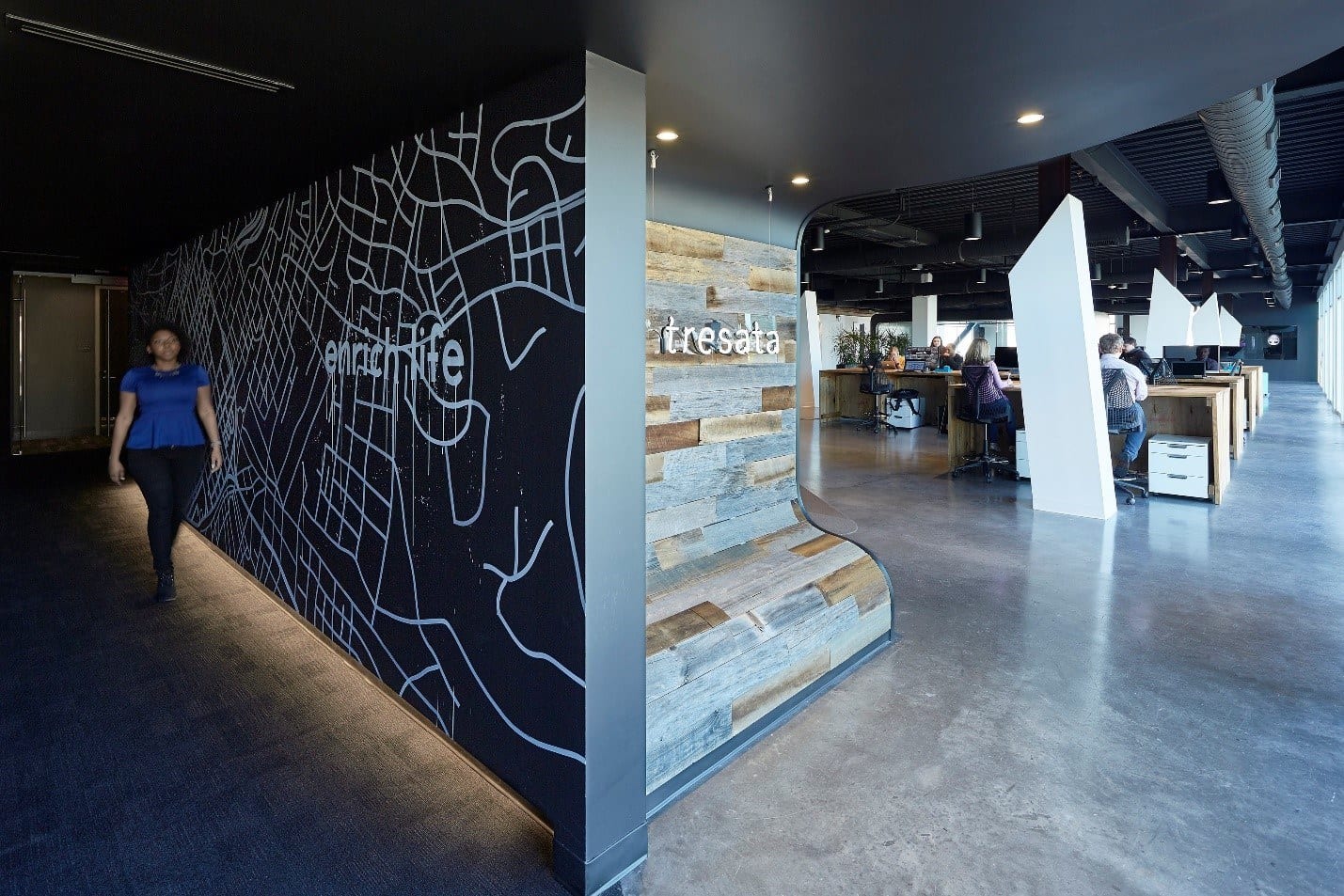 Tresata relocation charlotte reception and a wall of floor-to-ceiling windows.