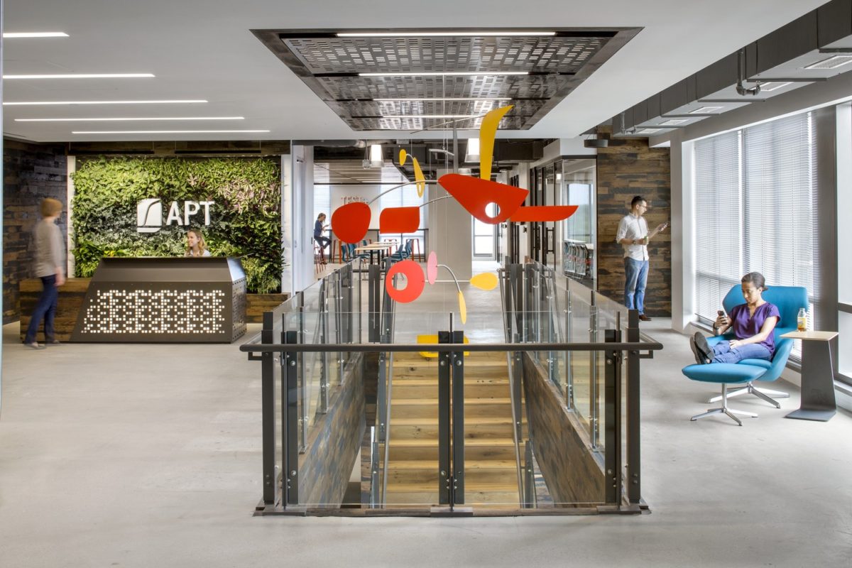 The public entrance and reception desk at APT, with the top of the interconnecting stair centered.