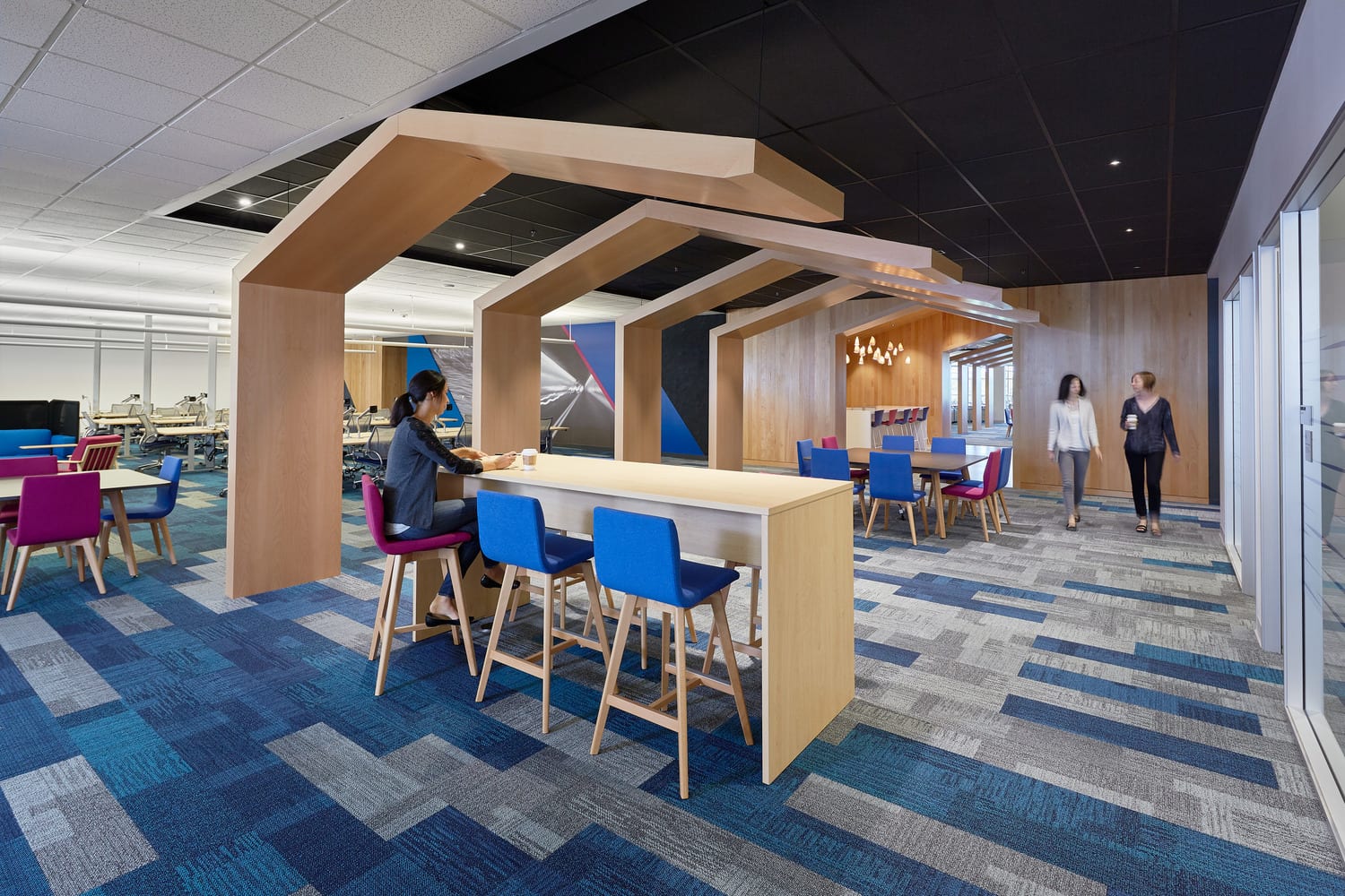 Workplace furniture grouped under collaborative work area