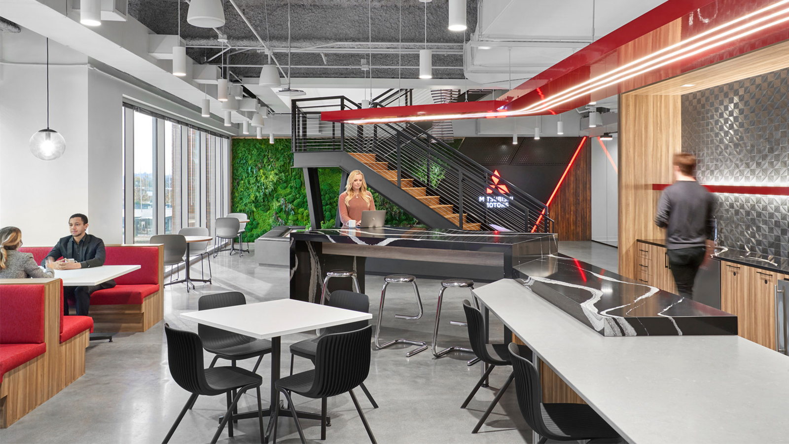 A central stair with a Zen garden and integrated green wall connects two floors